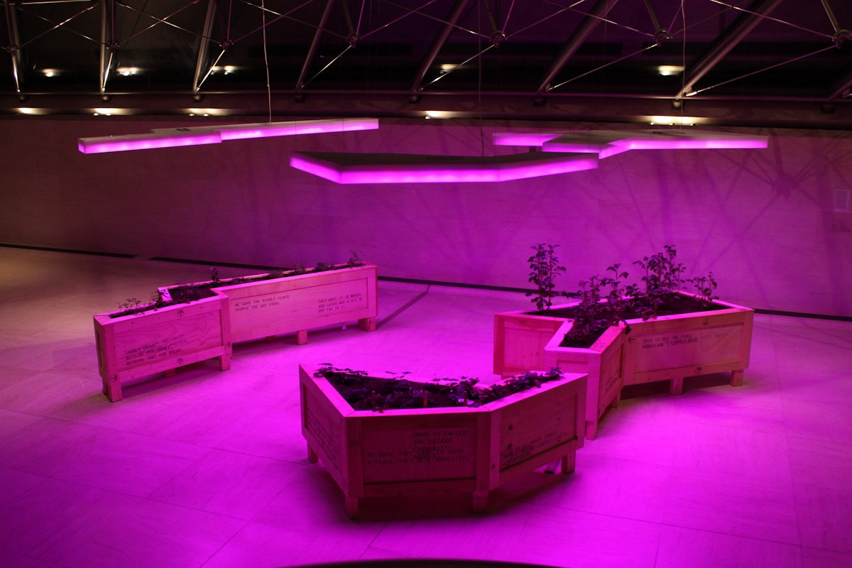 a group of planters sitting on top of a floor
