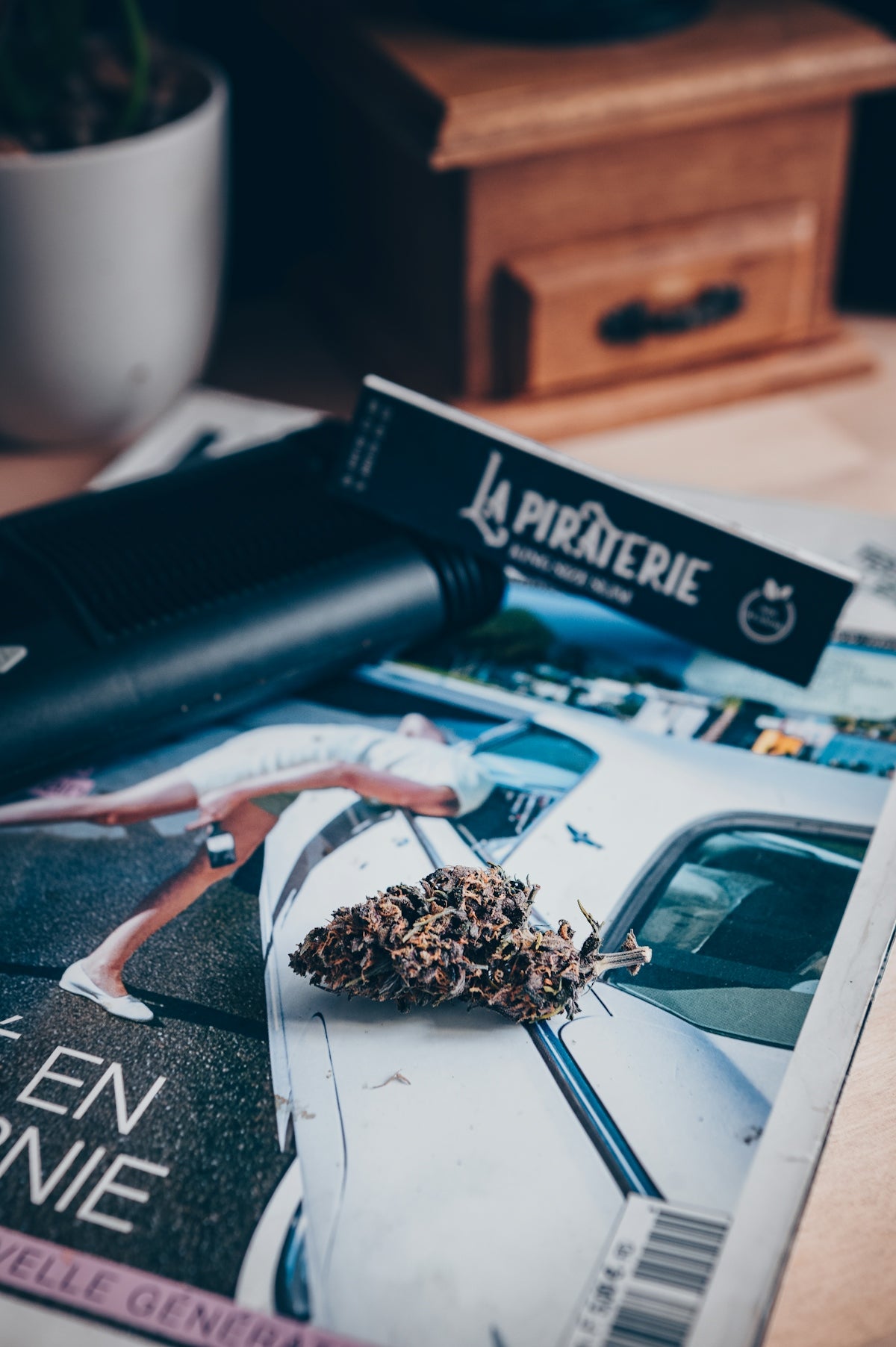 A magazine sitting on top of a wooden table