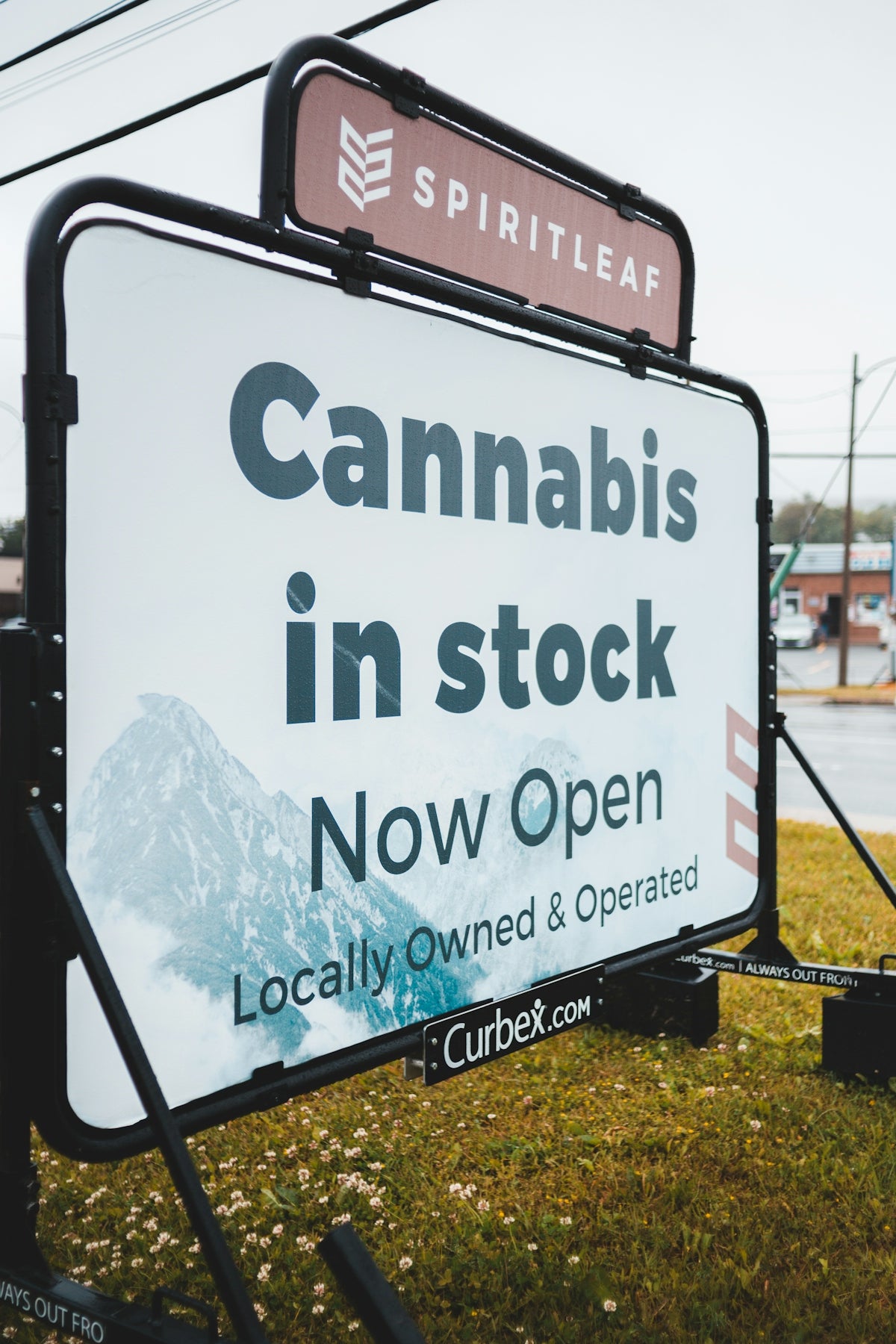 a sign advertising cannabiss in a small town
