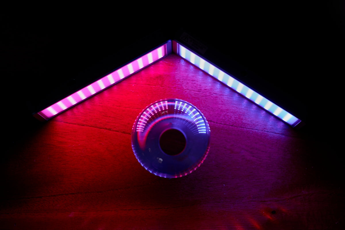 red and white barn with lights turned on during night time
