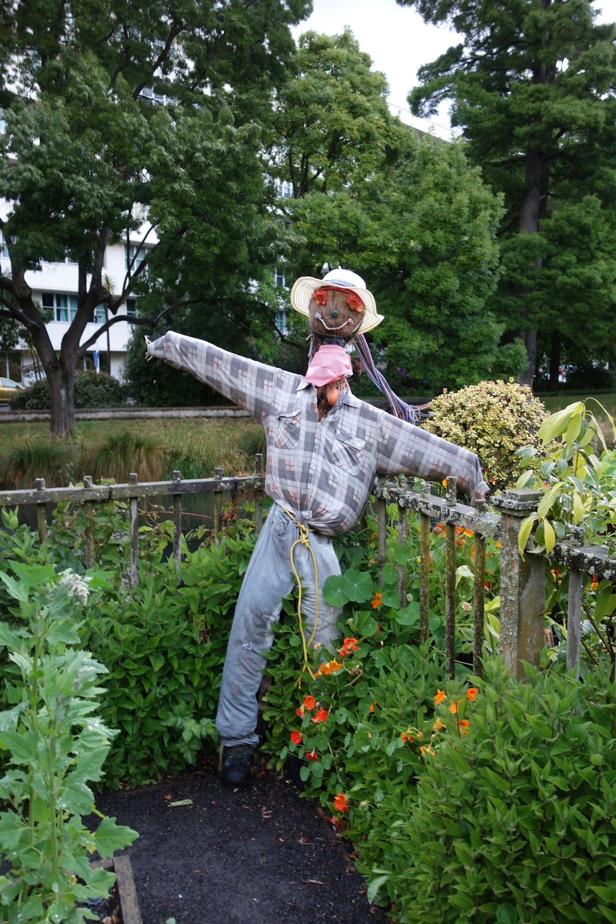 A man holding a child in a garden